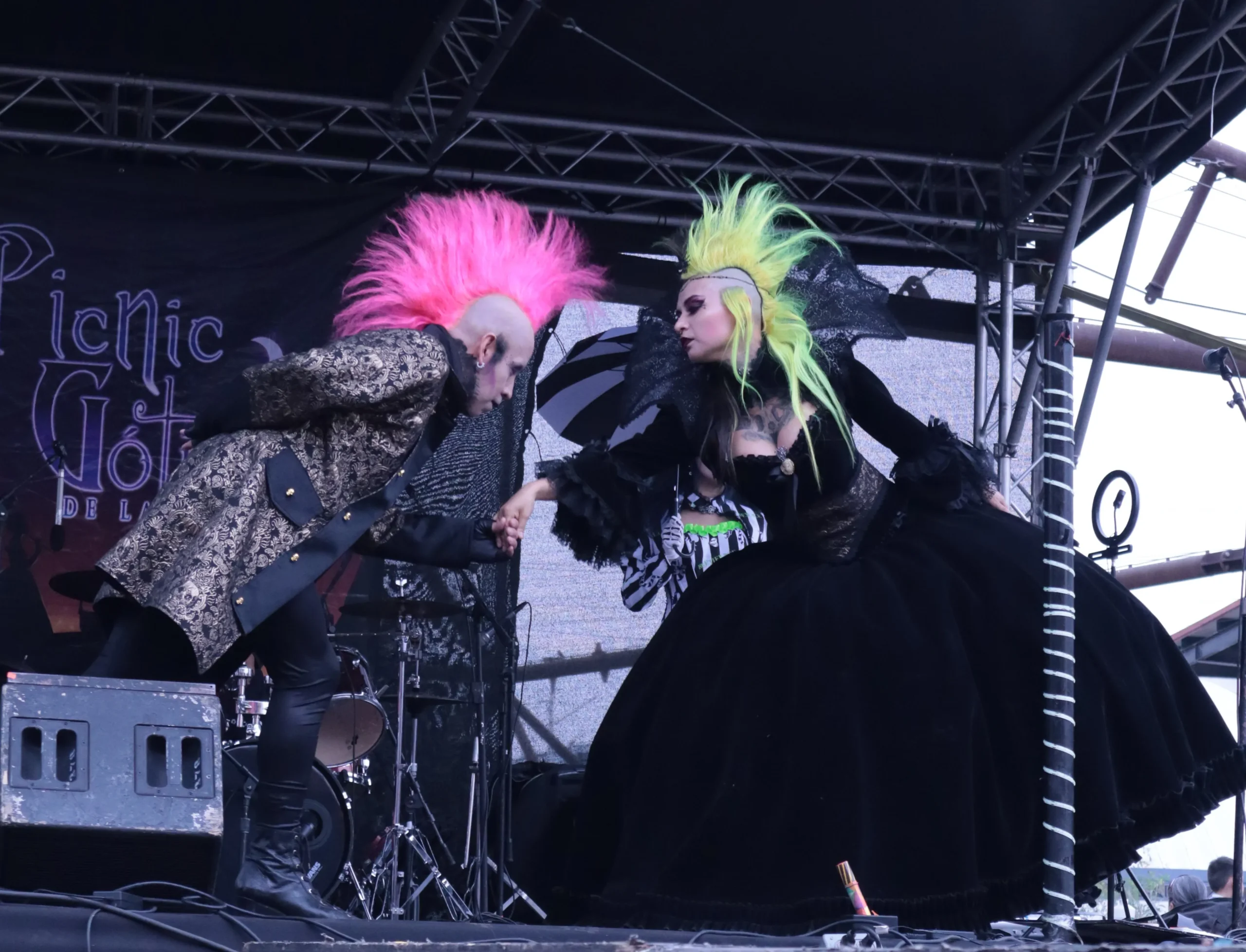 At the Gothic Picnic in the Faro de Tlahuac two models share a moment on the runway while showcasing gothic fashion. Tlahuac, Mexico City, May 17, 2025. Hans Leguízamo / MXPA