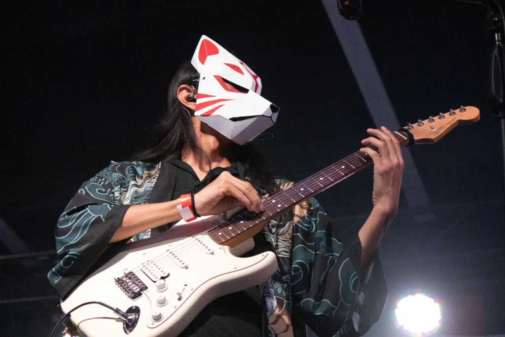 BAKEMONO's guitarist wearing his signature mask at their third anniversary concert. Mexico City, September 13, 2025. Hans Leguízamo / MXPA