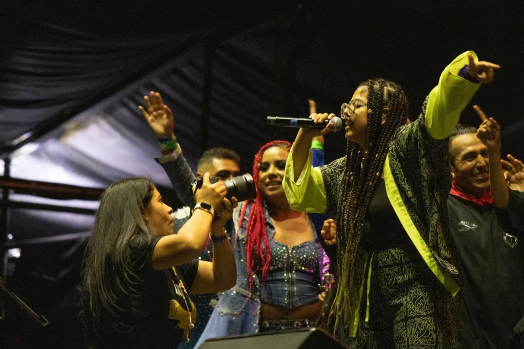 Prania Esponda, feminist singer-songwriter, performs at the mic, Mexico City, September 6. Hans Leguízamo / MxPA.