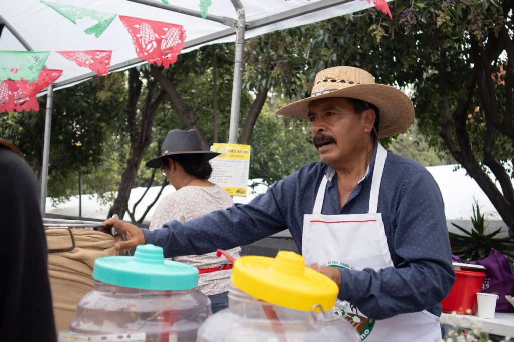 A vendor selling fresh water quenching the thirst of those attending the Corn Fair. Mexico City, September 28, 2025. Hans Leguízamo / MXPA.
