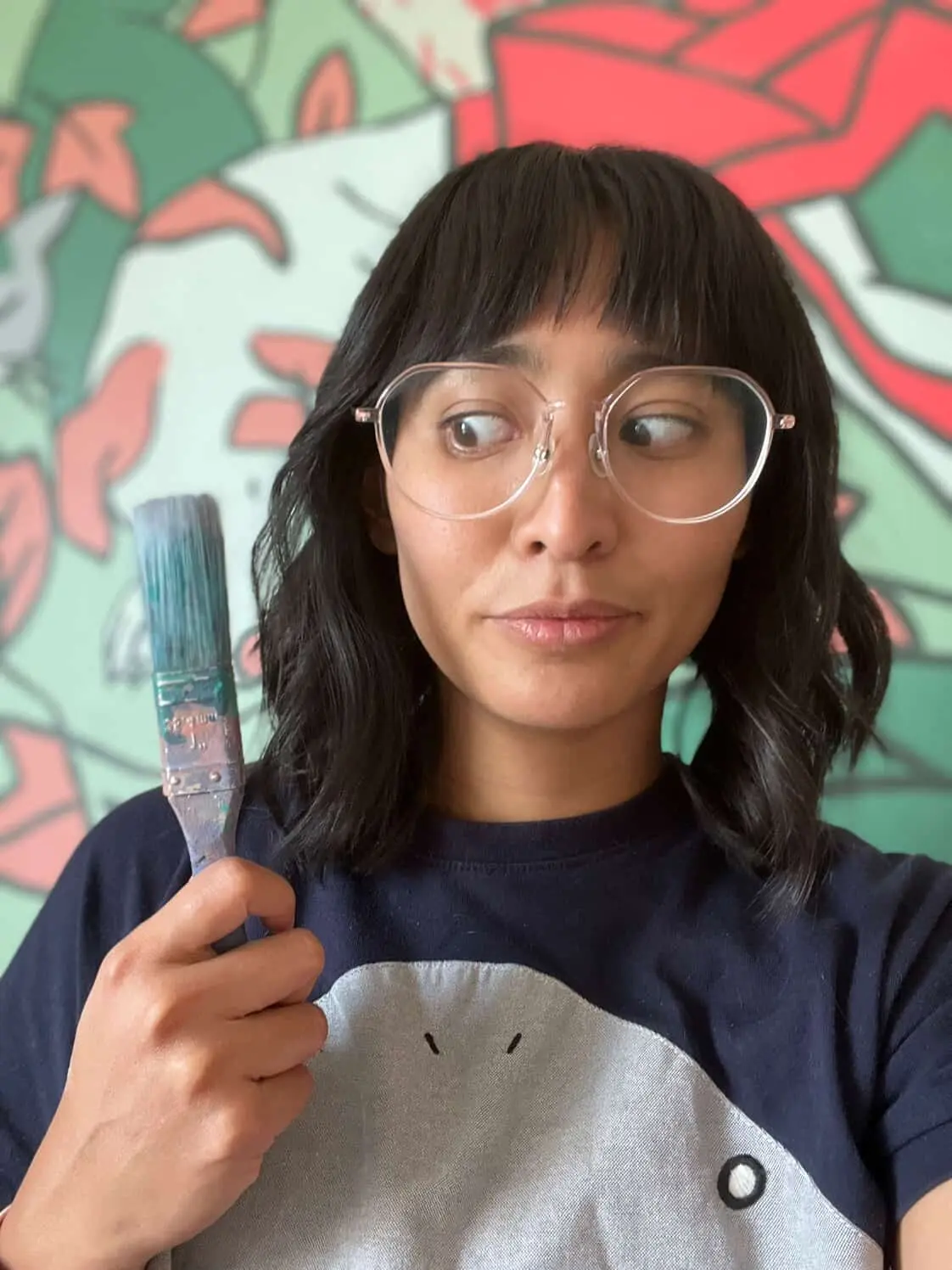 Youko Marian Horiuchi, holding a paintbrush. Special.