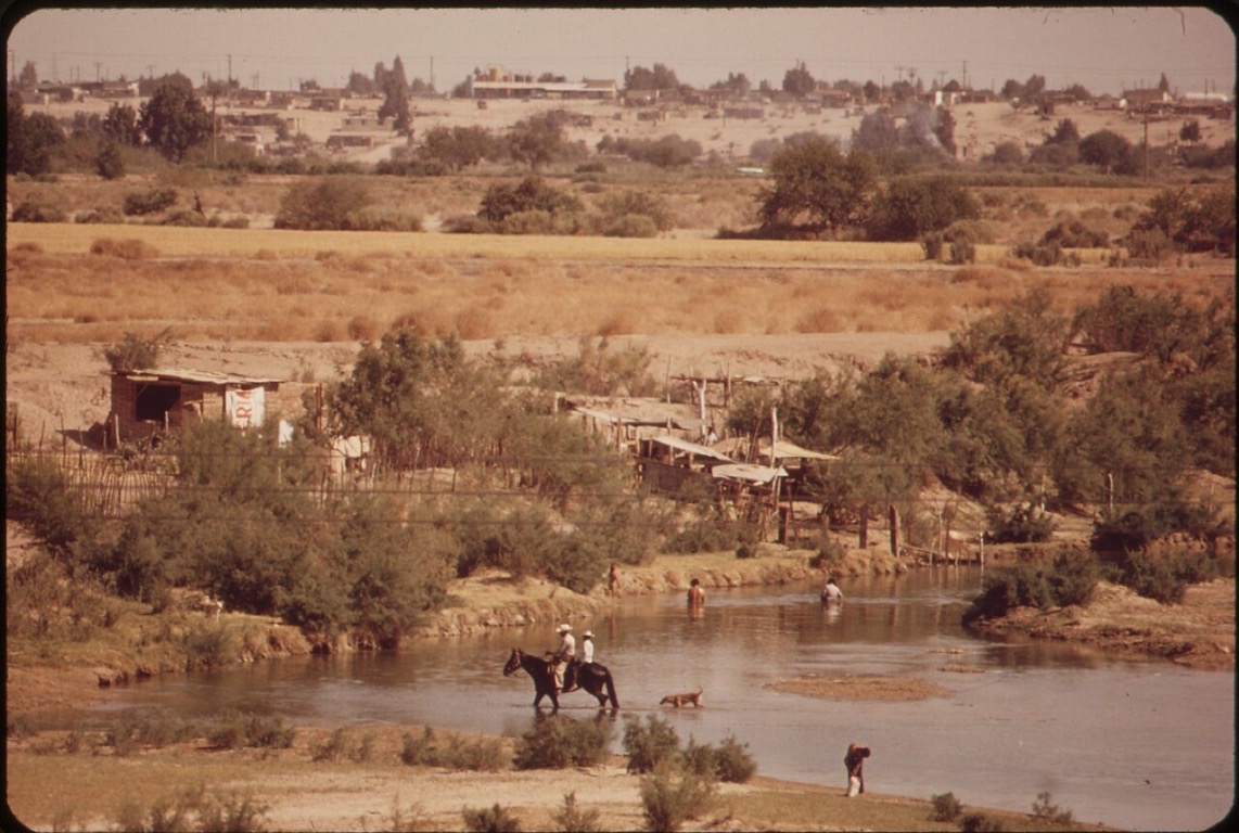 A rider crosses the Colorado River in Mexican territory, just south of the U.S. border.
